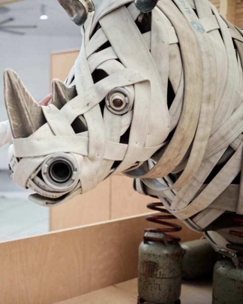 Animal sculpture rhino from old fire hoses